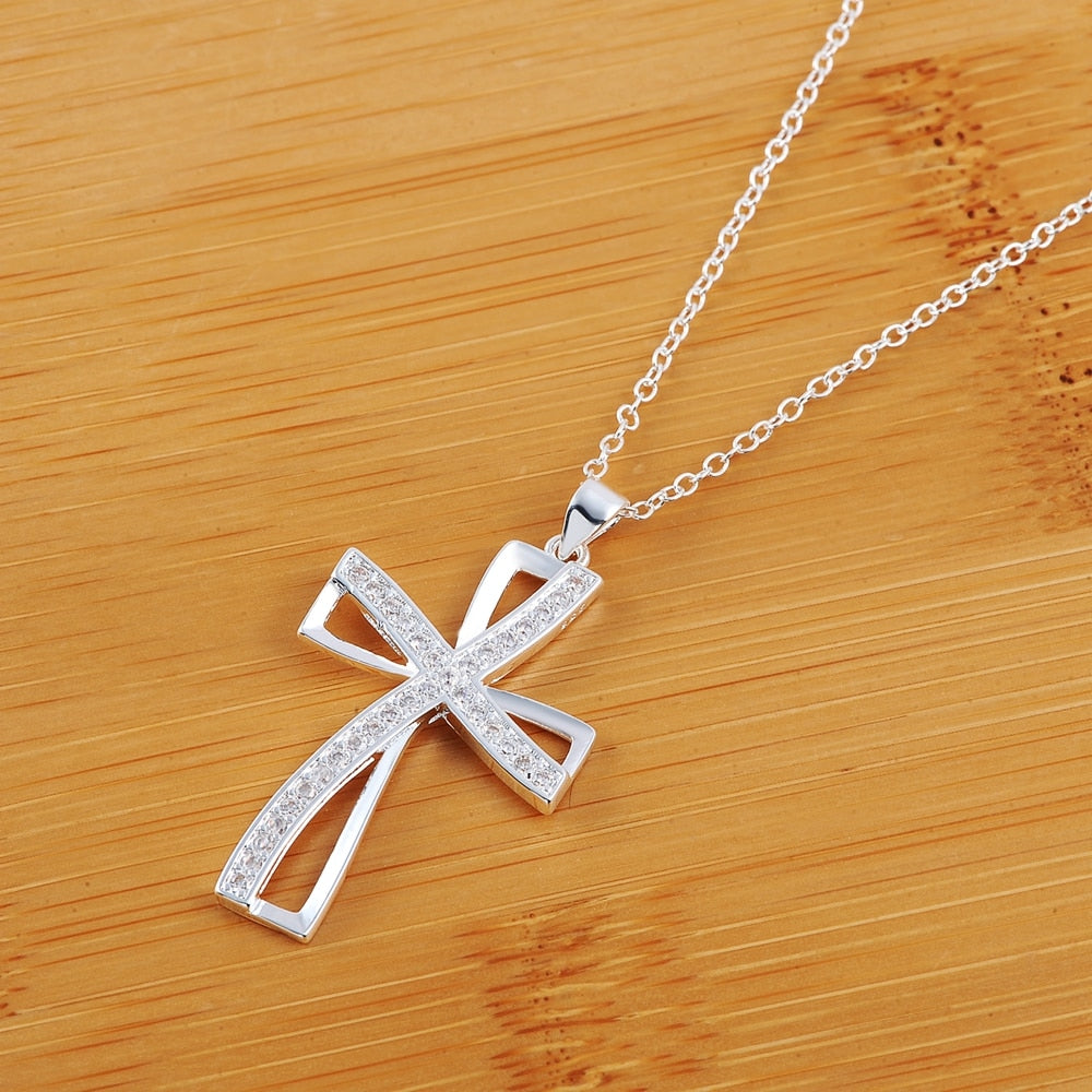 CHYLEANNA  Curved Cross Pendant